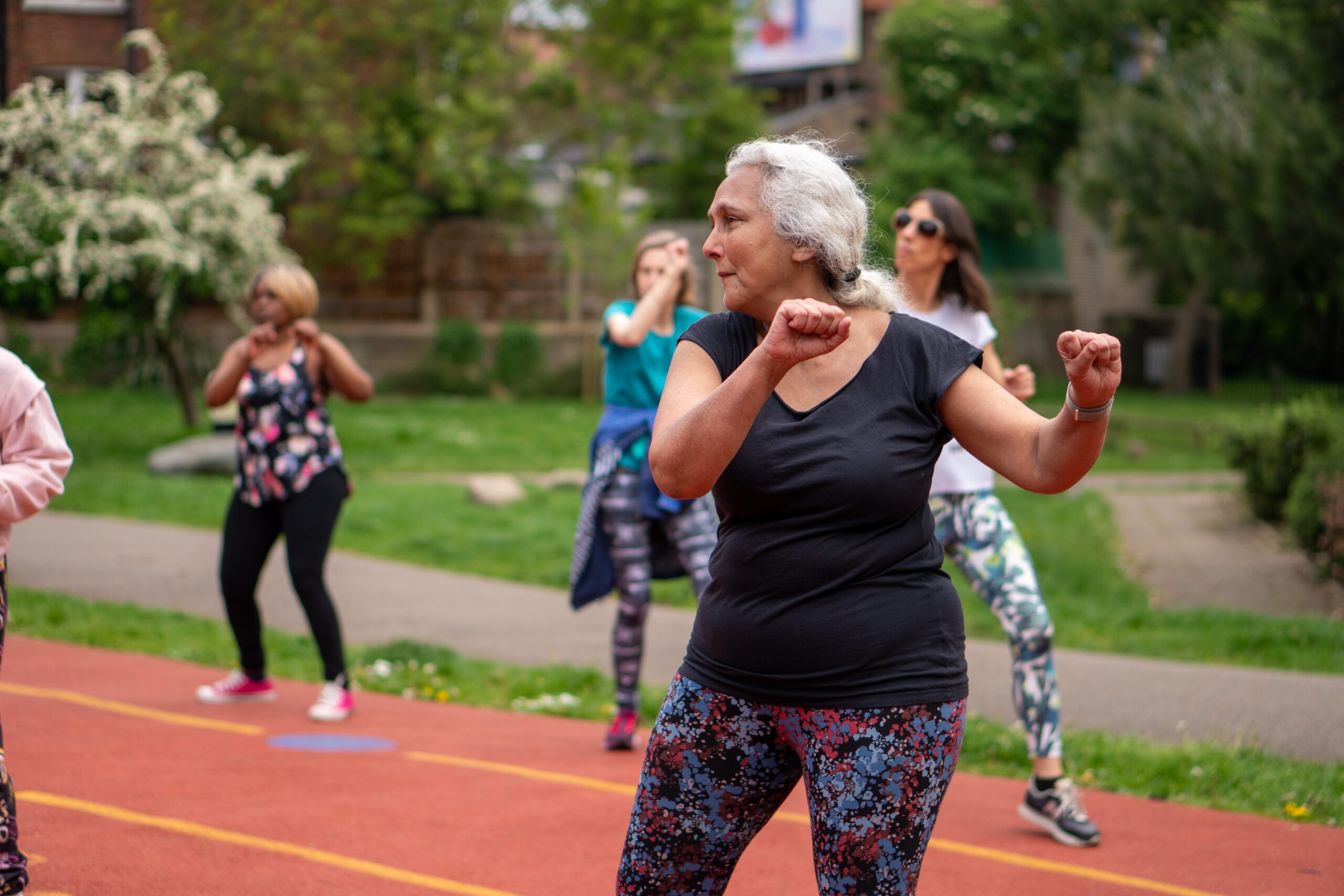 Elderly lady warming up for exercise